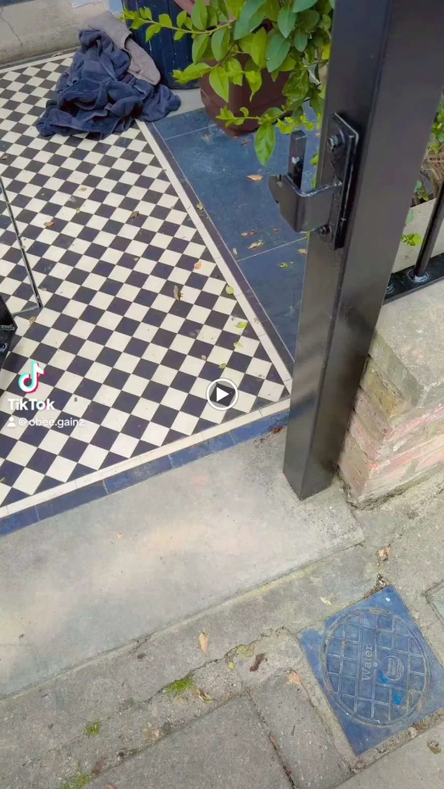 A cleaned black and white tiled path